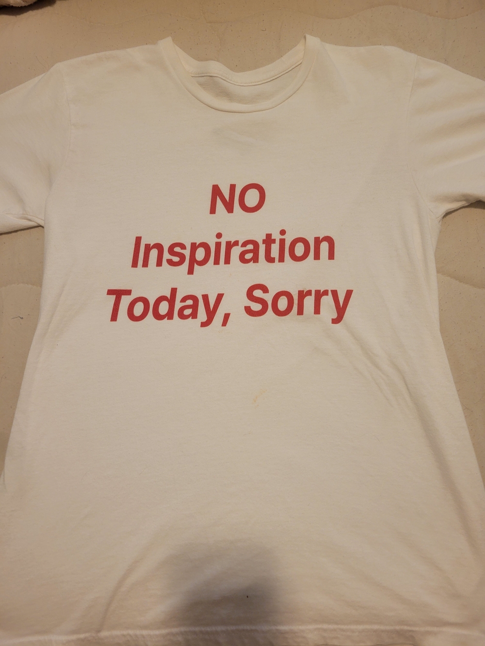 White Graphic Tee with Red 'NO Inspiration Today, Sorry' Text